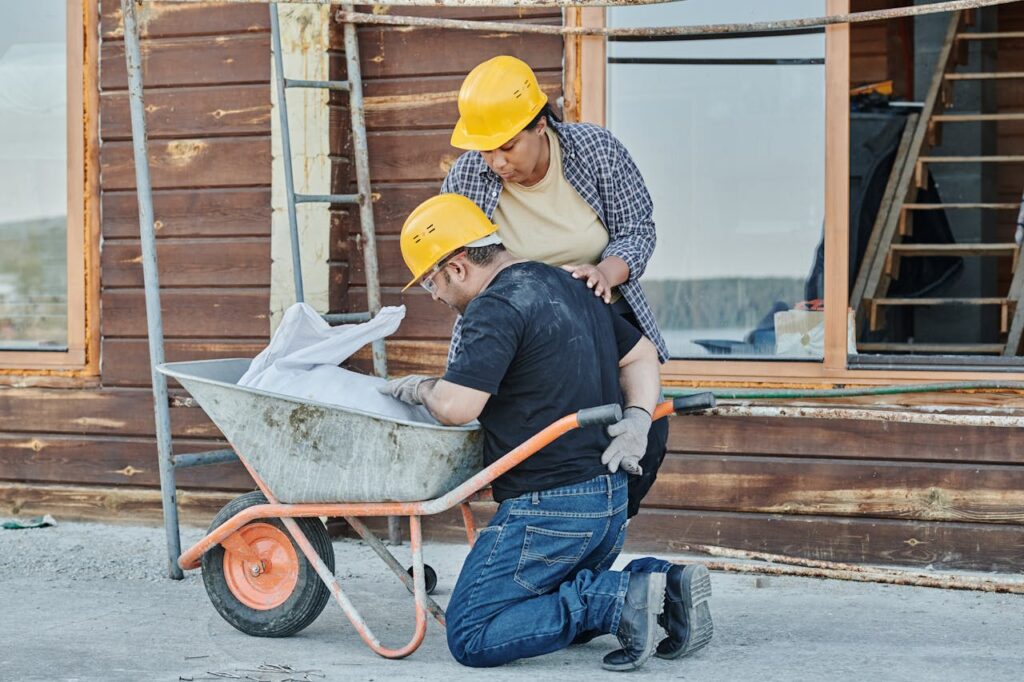 construction workers of a house foundation & pier leveling repairs