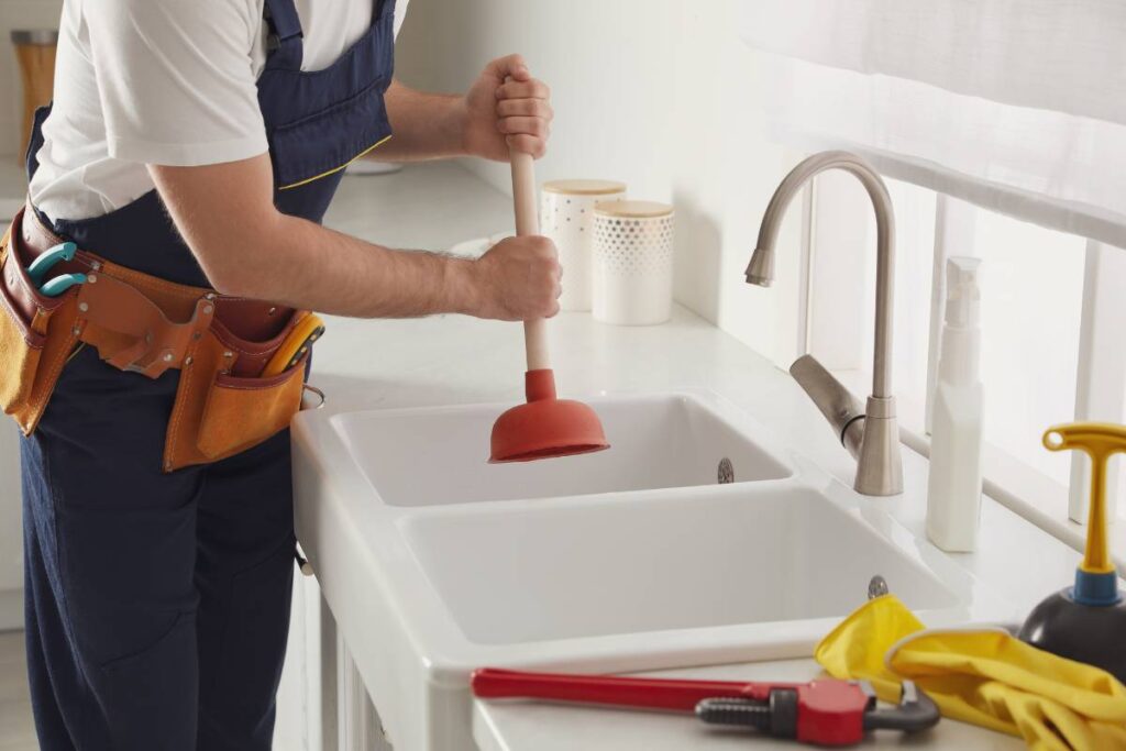 how to unclog a drain without chemicals with the help of a plumber