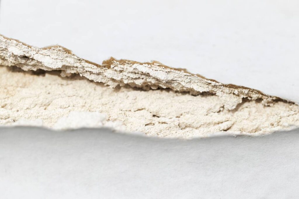 what causes cracks in sheetrock